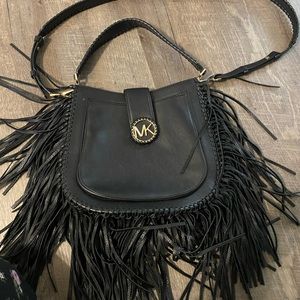 Michael kors black crossbody with fringe detail.